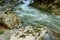 Rushing water in among the rocky walls