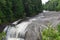 Rushing waterfall in a wilderness area on a hazy summer day