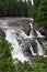 Rushing waterfall in a wilderness area on a hazy summer day