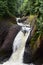 Rushing waterfall in a wilderness area on a hazy summer day