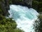 The rushing wild stream of Huka Falls near Lake Taupo, New Zealand.