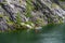 Ruskeala, Russia - June 14, 2022: View of the Great Marble Canyon of Ruskeala Mountain Park in Karelia. People are boating on the