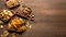 Rusks, chips, nuts and pistachios. Snacks in plates on table background