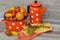 Russain cuisine: colorful tomatoes with orange napkin and khokhloma spoon, on rustic wooden table