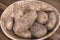 Russet potatoes in woven basket