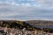 Russia, Arctic, Kola Peninsula, Teriberka: view with orthodox wooden cross on rocky hill and calm Barents Sea near center of the