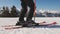 Russia. Arkhyz. January 2020. A skier puts on skis at a ski resort.