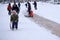 Russia Berezniki 20 February 2018: children and adults slide down the icy hell on the city square in winter. Winter landscape .