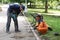 Russia, city of Magnitogorsk, - August, 19, 2015. Workers assemble anti-vandal benches in a city park