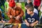 Russia, city Moscow - September 6, 2014: The child observes the master, who makes leather goods. Master class for the