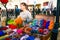 Russia, city Moscow - September 6, 2014: Woman knits on the street. Women`s hands knit a colorful product made of wool