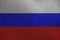 Russia flag depicted in paint colors on old brushed metal plate or wall closeup. Textured banner on rough background