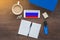 Russia flag, notebook, student, smartphone and wireless headphones on a wooden desktop