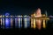 Russia, Irkutsk - July 19, 2019: Colorfull reflection of Ferris wheel, fountain and lights in Angara river, night photo