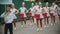 RUSSIA, KAZAN 09-08-2019: A wind instrument military parade - women with bright make up in small skirts playing red