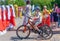 Russia, Kazan - May 31, 2019: Disabled boy with glasses on a four-wheeled bicycle on a bright sunny day. Charity bike ride.