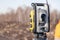 Russia Kemerovo 2019-03-15. Land surveyor equipment. Robotic total station theodolite standing on tripod. Equipment used for