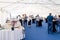 Russia Kemerovo 2019-07-27 People at catering stand-up meal party, waiters, guests on banquet, table setting, wine glass, snacks,