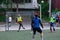 Russia, Khabarovsk - Jun 11, 2019: street domestic playing soccer. Young guys play soccer on a green grass