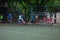 Russia, Khabarovsk - Jun 11, 2019: street domestic playing soccer. Young guys play soccer on a green grass