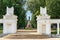 Russia  Kostroma  July 2020. Entrance gate of the park and a distant view of the Lenin monument.