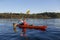 Russia, Ladoga lake, 15.07.2018: kayaker on kayak floating on the forest lake