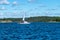 Russia, Lake Ladoga, August 2020. Sailing yacht with people on the water.