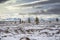 Russia. Magadan Region. Beautiful Lake Momontay against the backdrop of a snowy mountain range.