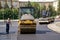 Russia, Magnitogorsk, August 15, 2019. The process of laying and leveling asphalt on one of the city streets. Road compactor