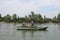 Russia, male fishermen sail in a motor boat on the river in summer for tourism and recreation