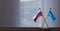 Russia and Midway Islands flags on table.