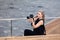 Russia Moscow 2019-06-17 Hobby and travel. Young caucasian girl with professional photo camera in summer, outdoors