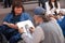 Russia Moscow 2019-06-17 Street Artist Draws Sketch Portrait of a woman. Street painter draws portrait of woman outdoors