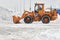 Russia, Moscow - 8 February, 2018. Big orange tractor removing snow