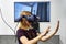 RUSSIA, MOSCOW - APRIL, 04, 2019 Young blonde girl in augmented reality headset.