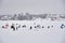 Russia, Moscow region, December 2020. On the frozen snow-covered lake there are many tents and fishermen.