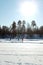 Russia, Moscow region, Grebnevo 08 February, 2020: Ice skaters. Barsky pond Rink. Winter sunny day