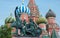 Russia, Moscow, St. Basil`s cathedral with Monument to the citizen Minin and prince Pozharsky.