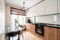 Russia, Nizhny Novgorod - January 10, 2018: Private apartment. Interior design. Small modern kitchen in white and wenge