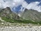 Russia, North Ossetia - Alania. The tops of the mountains framing Tsey Tseyskoe, Tseyskoye gorge in sunny June day