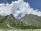 Russia, North Ossetia - Alania. The tops of the mountains framing Tsey Tseyskoe, Tseyskoye gorge in sunny June day