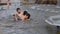Russia, Novosibirsk, 10 July 2016. Company boys bathe in the fountain