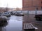Russia, Novosibirsk, April 15, 2013: a street flooded with dirty water in the city in the spring lies a makeshift bridge over