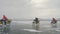 Russia, Olkhon - February 28, 2018: Cyclists travelers from Poland ride ice on bicycles. Extremes cross Lake Baikal