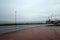 Russia, Petropavlovsk-Kamchatsky: The car goes on the waterfront near the port in the rain