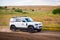 Russia, Rostovskaya oblast, 2021 June 09: Modern new SUV car Land Rover Defender, test drive on dirt road. Offroad 4x4