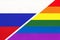 Russia or Russian Federation national fabric flag vs rainbow flag of LGBT community from textile opposite each other