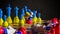 Russia's aggression against Ukraine. Chess in the colors of flags. 3D rendering illustration.