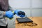 Russia, Saint Petersburg 9 July 2020:Treatment of laptop and mouse with antiseptic-hands in gloves close-up.