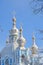 Russia, Saint-Petersburg. Smolny Cathedral in winter day. It`s snowing, snowflakes in the sky